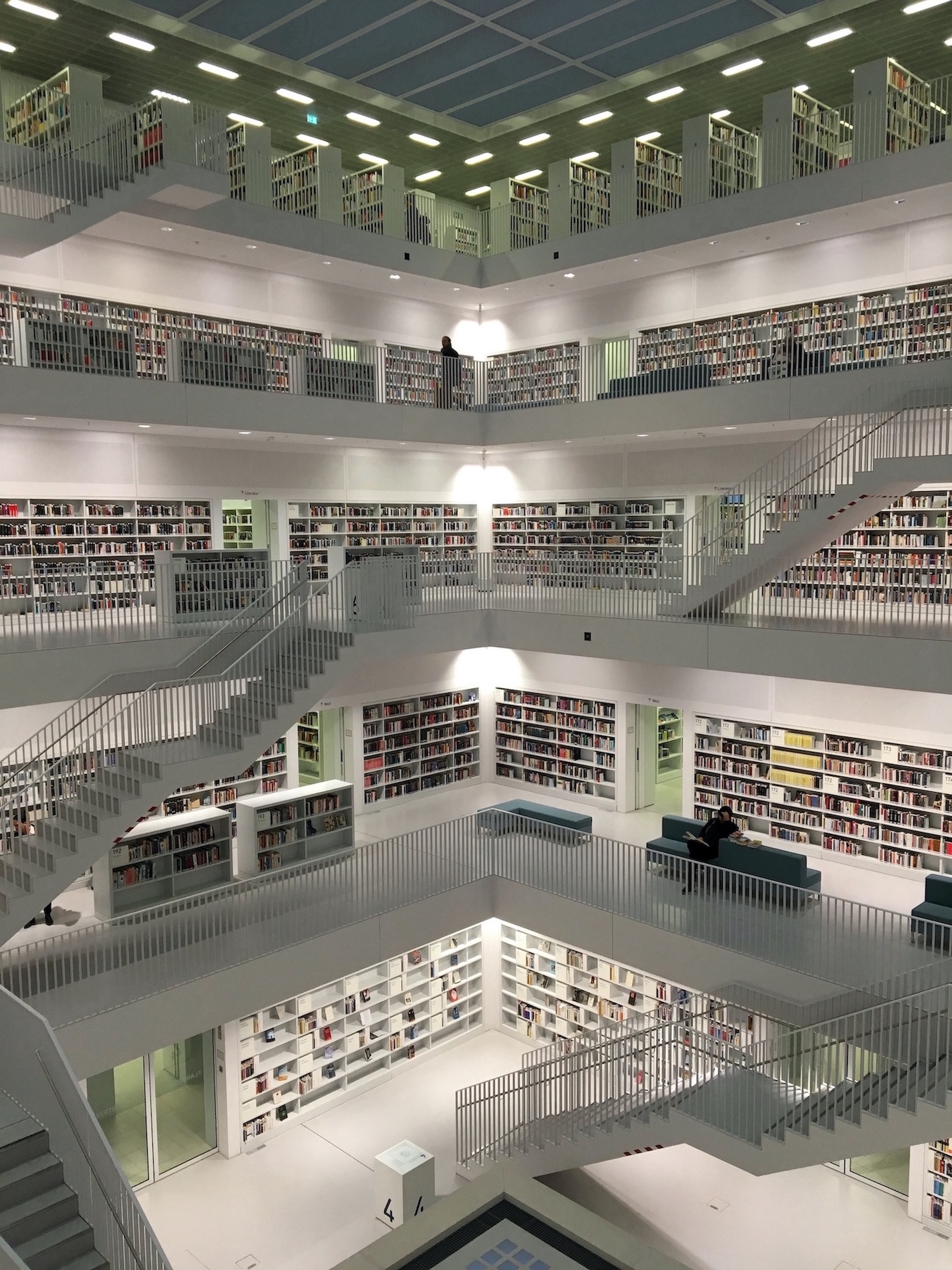 A multi-story library. Photo by Tobias Fischer on Unsplash.